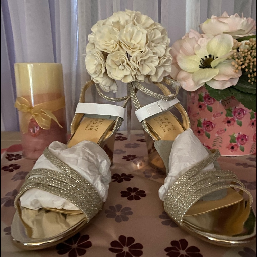 New in the box Badgley Mischka gold wedge sandals, size 7 1/2, 3 1/2” heel.